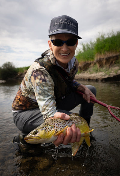Artist AD Maddox wearing her Secluded Brown SunPro and catching browns